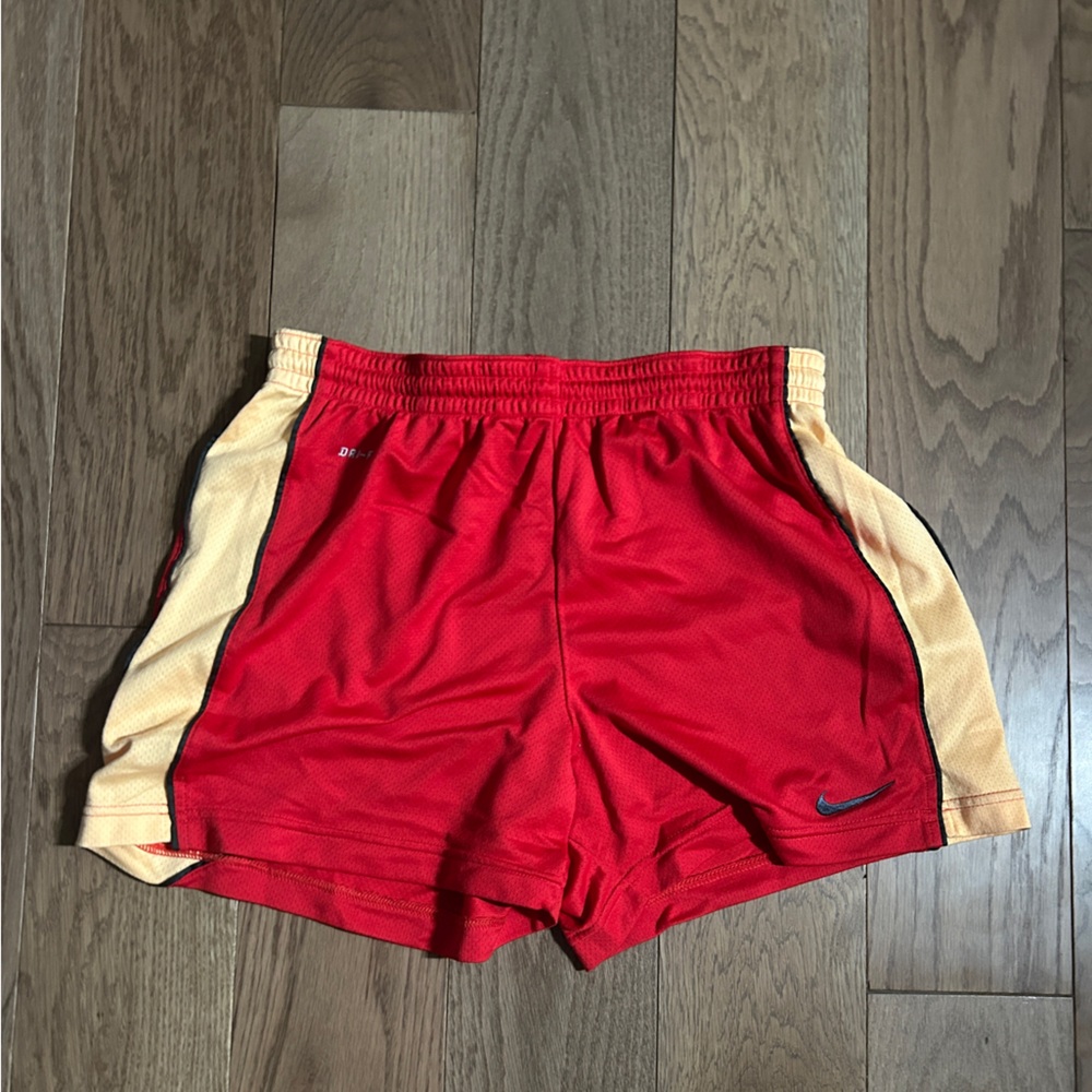Red and orange nike shorts